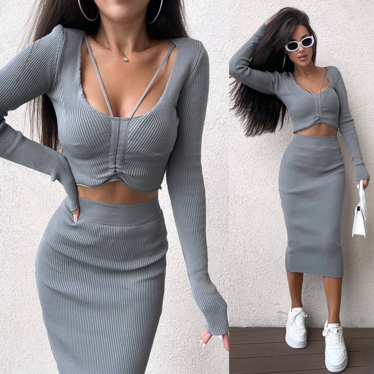 Woman wearing a gray ribbed two-piece outfit with a white background