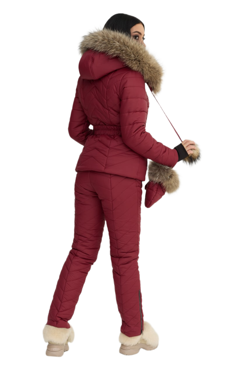 Person wearing a red winter outfit with fur trim on a white background