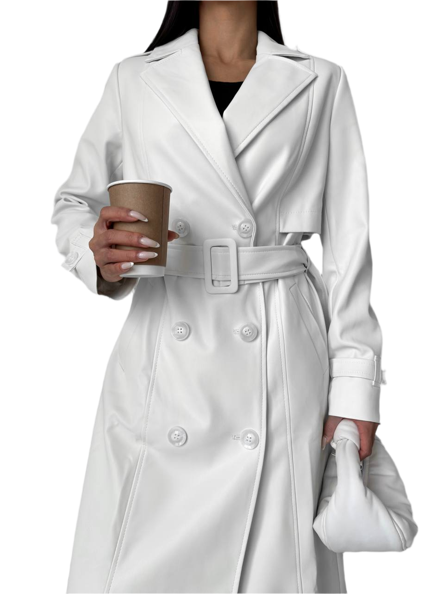 Person wearing a white trench coat holding a coffee cup on a white background