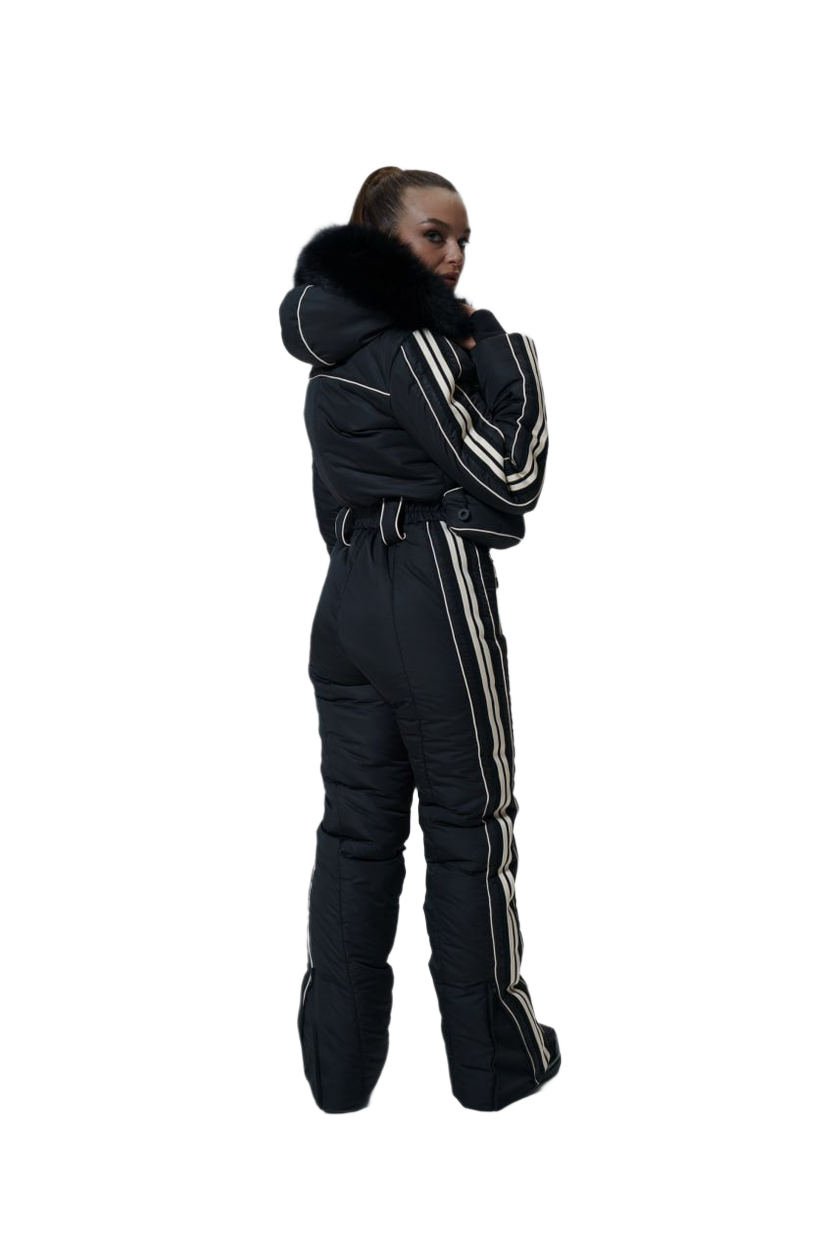 Person wearing a black snowsuit with white stripes on a white background