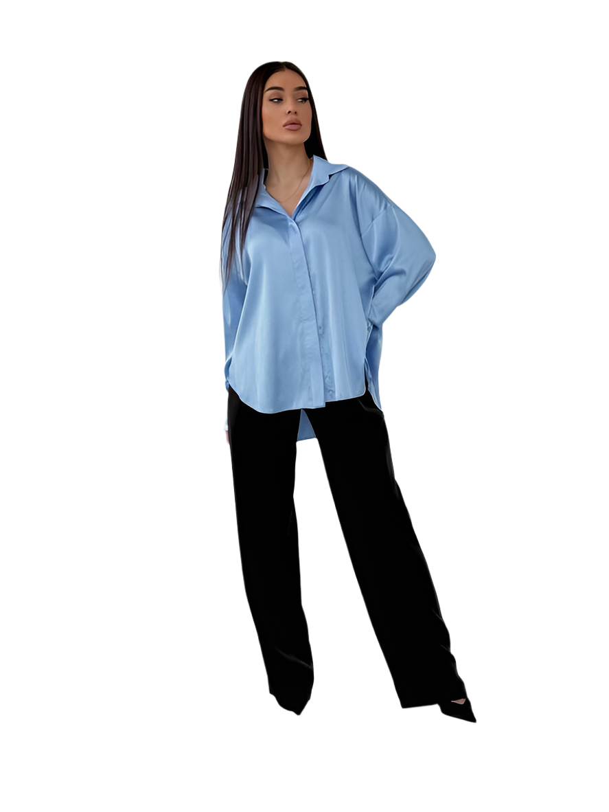 Woman wearing a light blue shirt and black pants on a white background