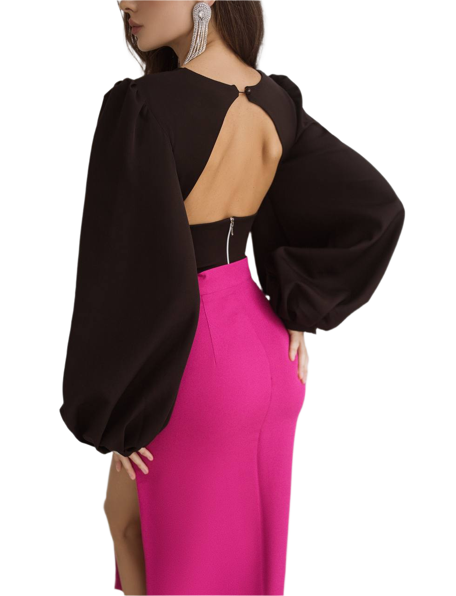 Black top with open back and pink skirt on a white background