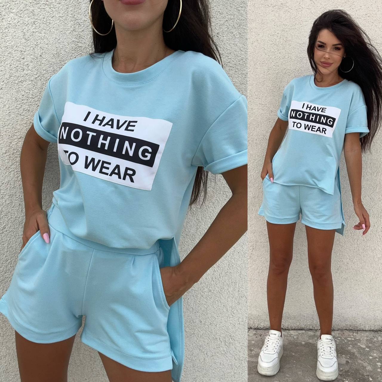 Woman wearing a light blue outfit with a shirt and shorts, featuring text 'I HAVE NOTHING TO WEAR'.