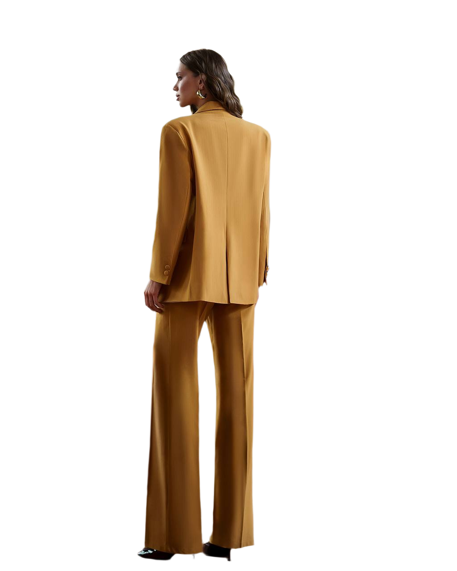 Woman wearing a mustard yellow suit on a white background