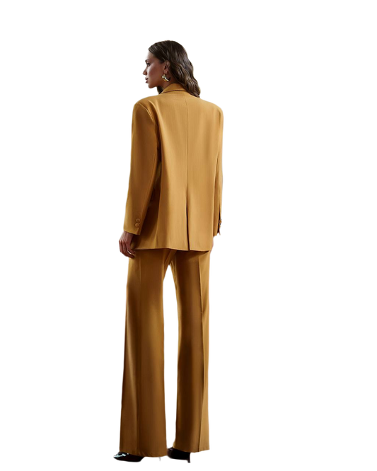 Woman wearing a mustard yellow suit on a white background