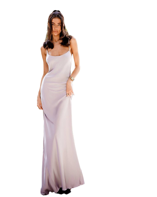 Woman wearing a long, light-colored evening gown on a white background
