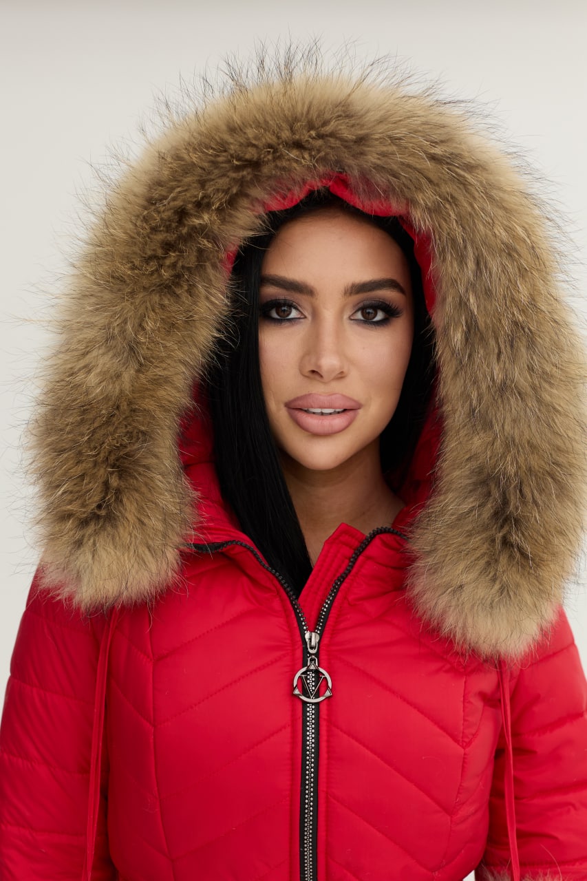 Red jacket with a fur-lined hood worn by a person on a white background