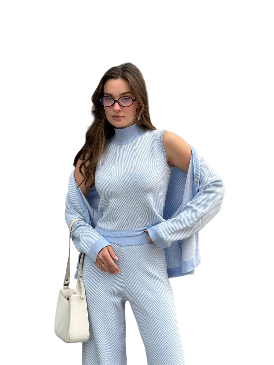 Woman wearing a light blue outfit with a white background