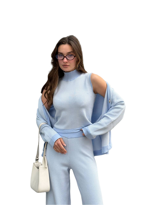 Woman wearing a light blue outfit with a white background
