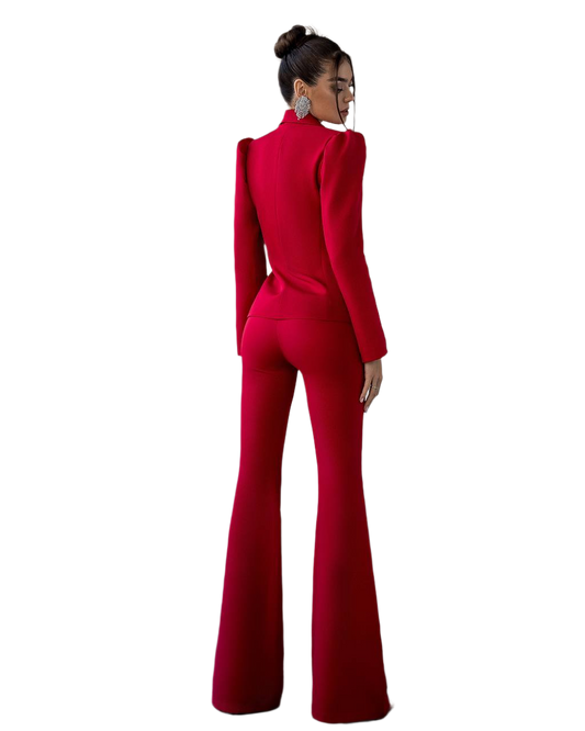 Red jumpsuit worn by a model on a white background