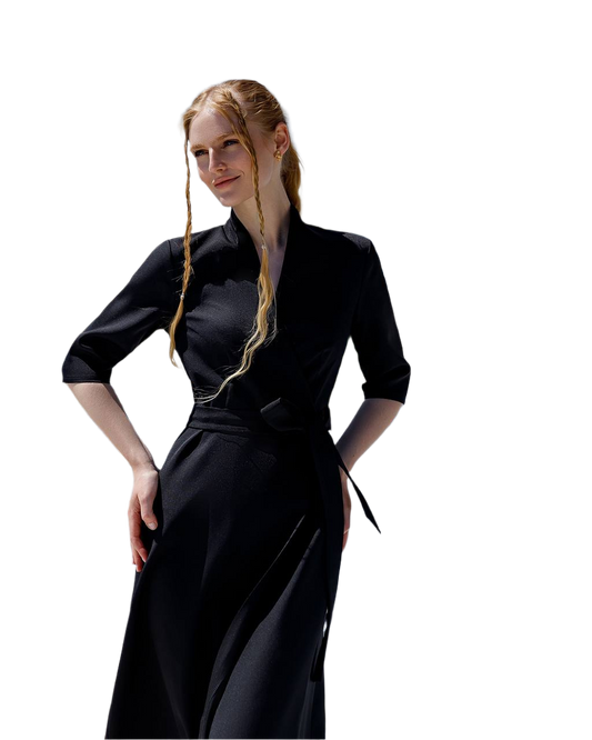 Woman wearing a black dress with a white background