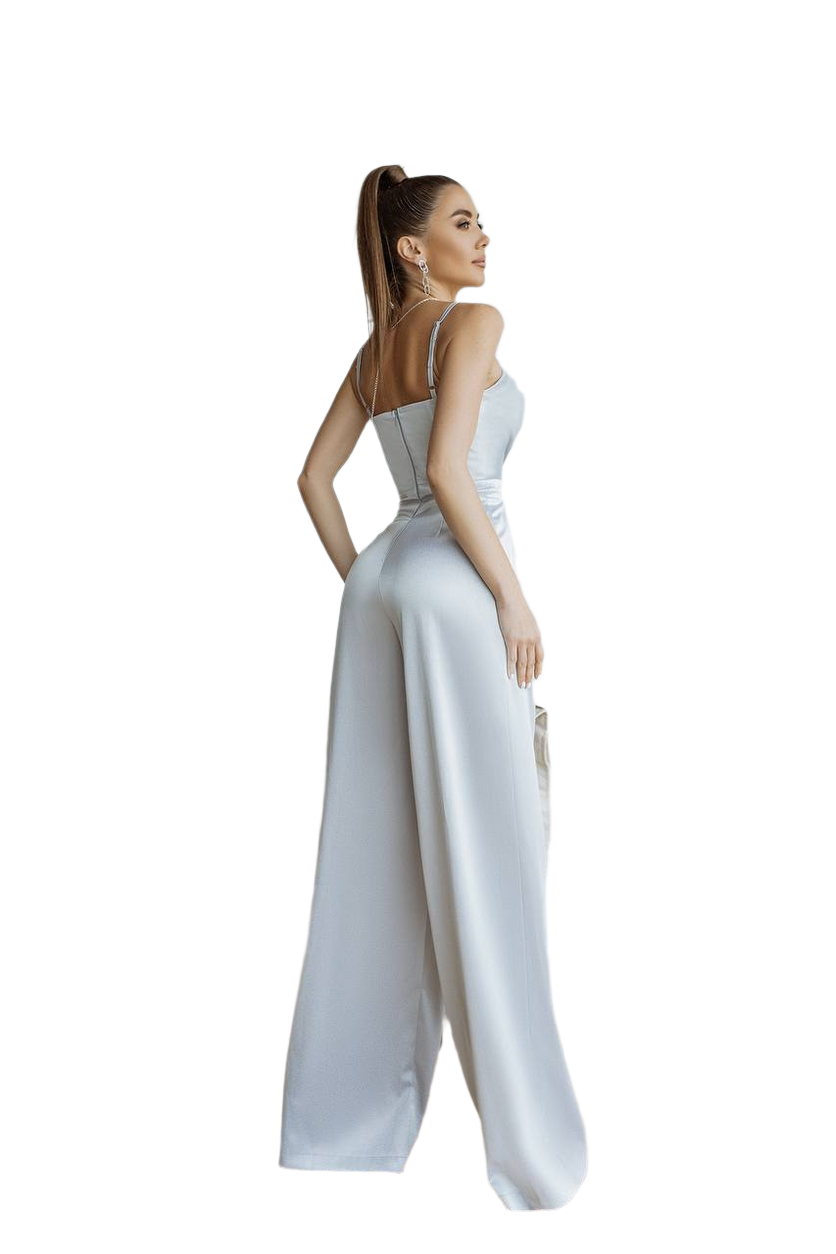 Woman wearing a white jumpsuit on a white background