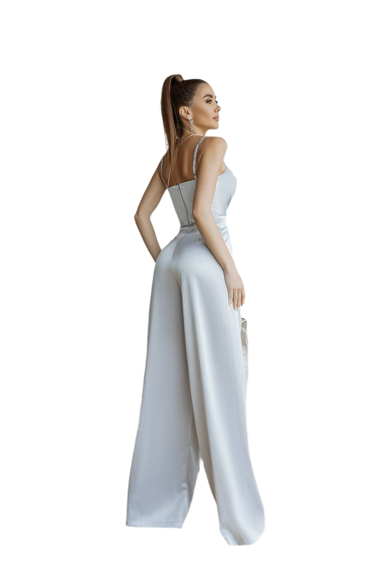 Woman wearing a white jumpsuit on a white background