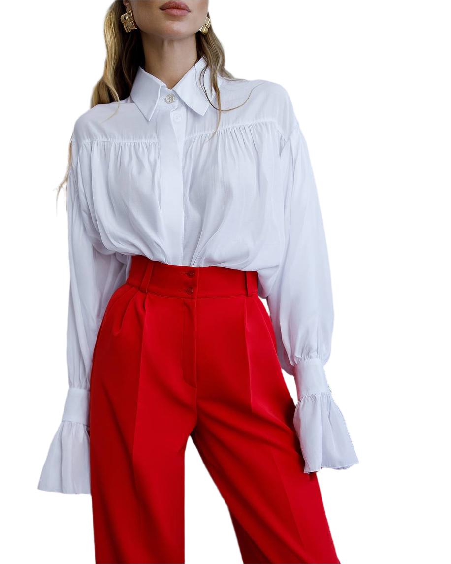 White blouse with ruffled sleeves and red pants on a white background