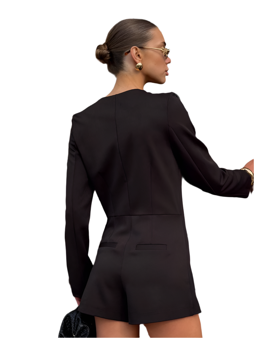 Woman wearing a black suit with a white background
