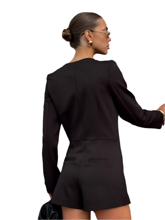 Woman wearing a black suit with a white background