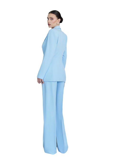 Woman wearing a light blue suit on a white background