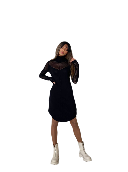 Woman wearing a black dress with white boots on a white background