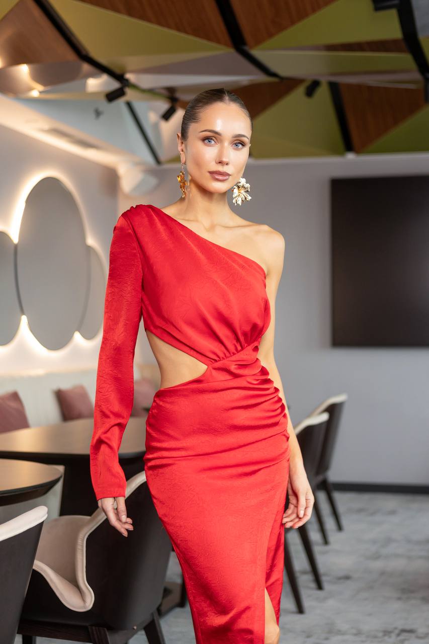 Woman in a red dress standing in a modern restaurant setting