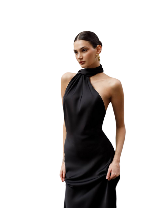 Woman wearing a black halter neck dress on a white background