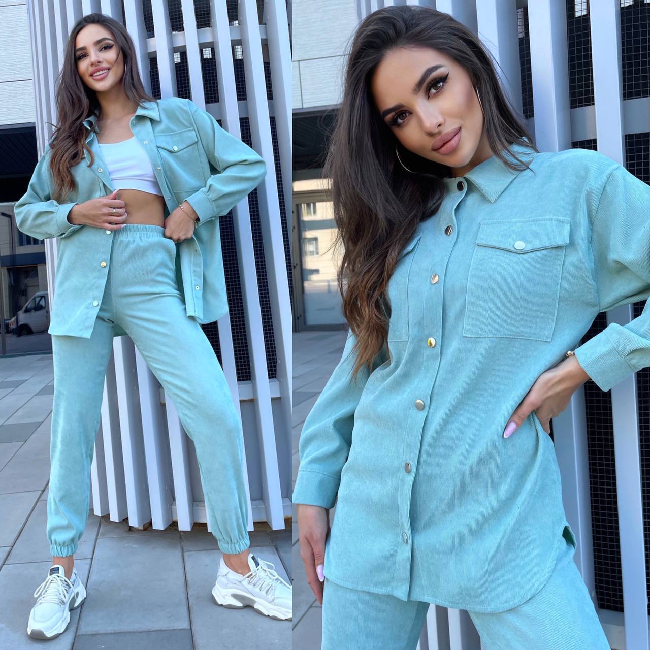 Woman wearing a teal outfit standing in front of a modern building.