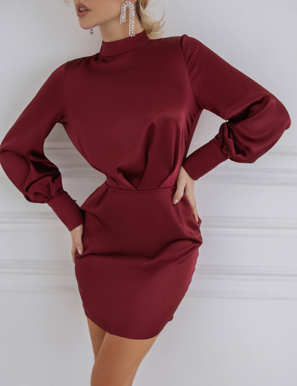 Maroon dress with long sleeves on a white background