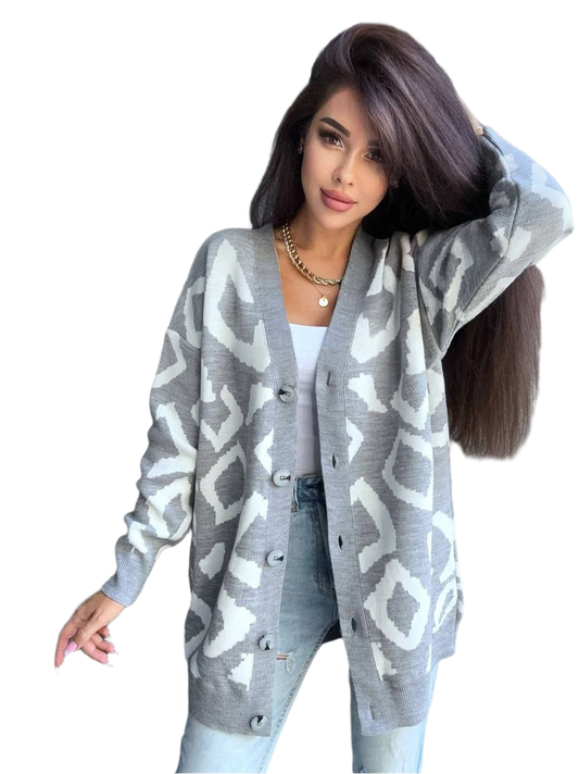 Woman wearing a gray patterned cardigan on a white background