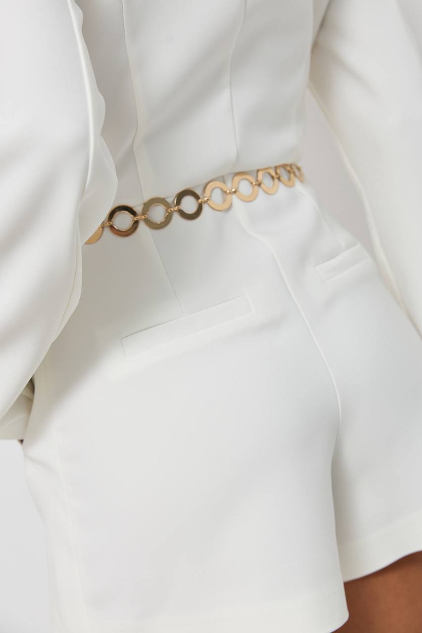Gold chain belt on a white outfit