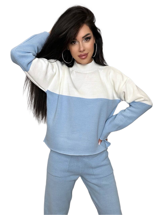 Woman wearing a blue and white color-blocked outfit on a white background