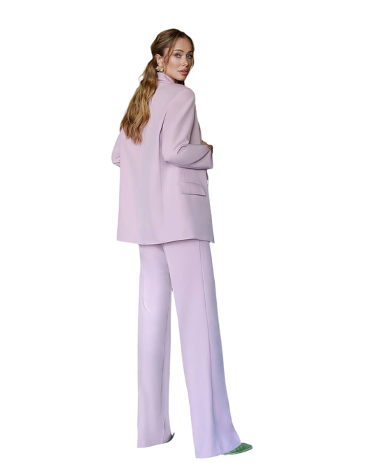 Woman wearing a light purple suit on a white background
