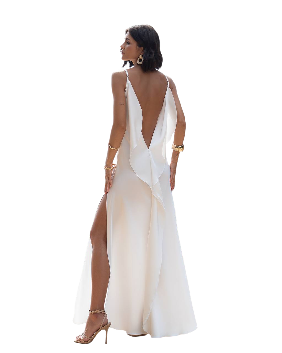 Woman wearing a white evening gown with a deep neckline and slit on a white background