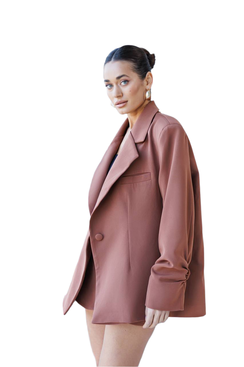 Woman wearing a pink coat on a white background