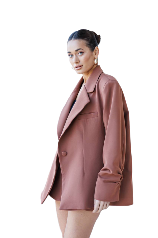Woman wearing a pink coat on a white background