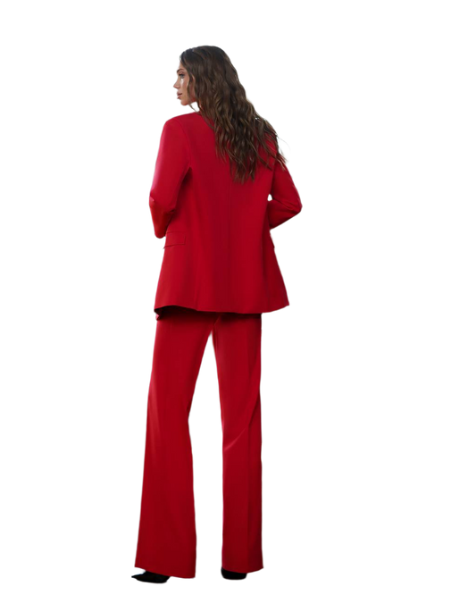 Woman wearing a red suit on a white background