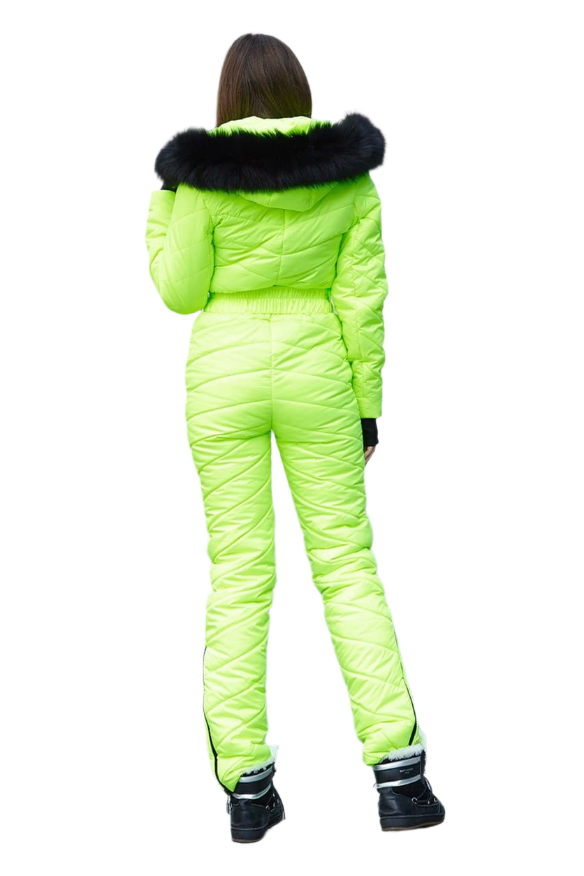 Person wearing a bright green ski suit with black fur trim on a white background