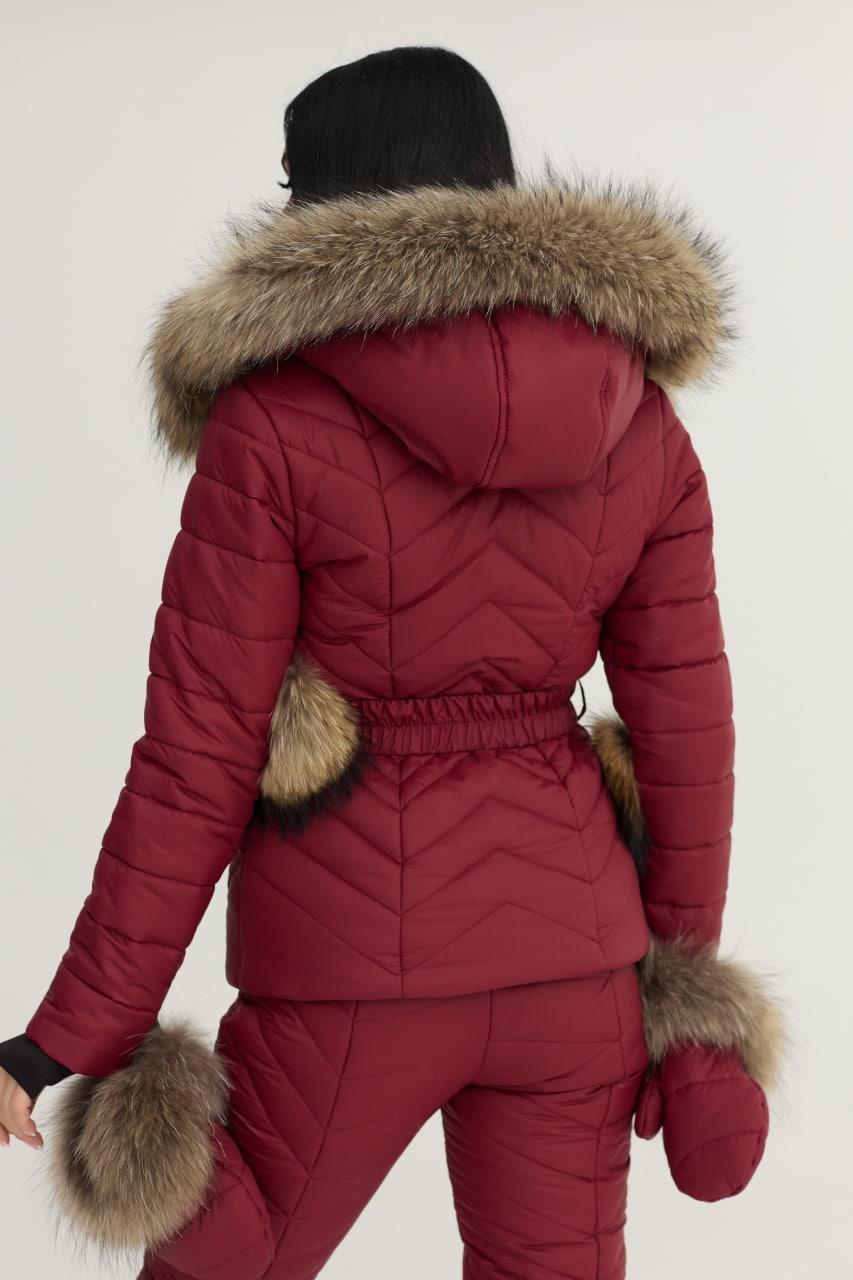 Red winter coat with fur trim on a white background