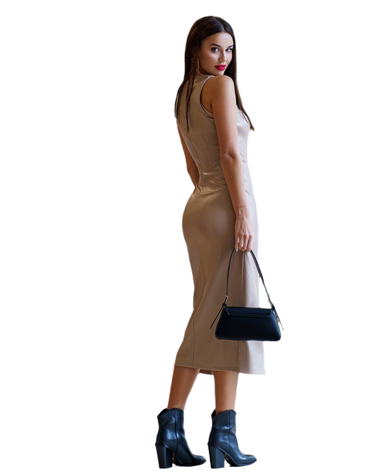 Woman wearing a beige dress and black boots, holding a black handbag on a white background