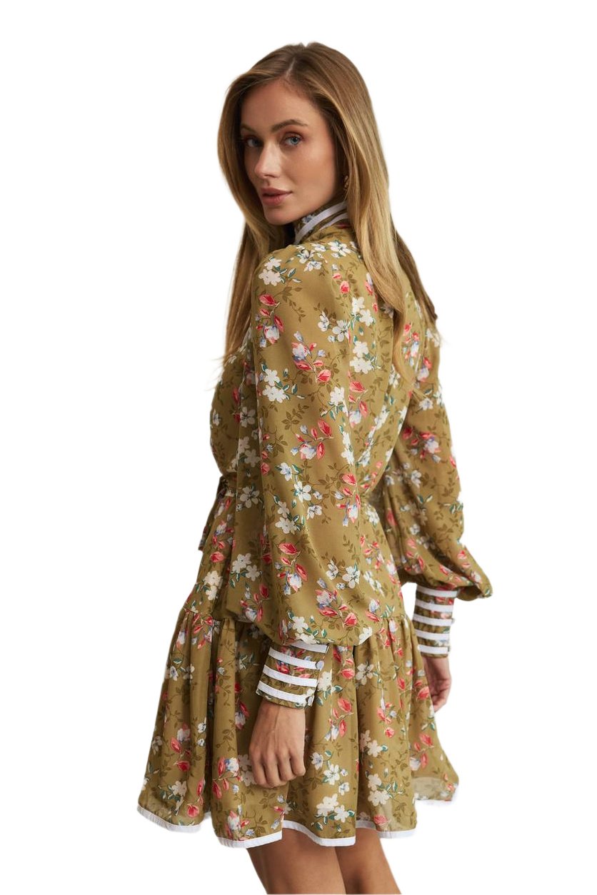 Woman wearing a floral dress with a white background
