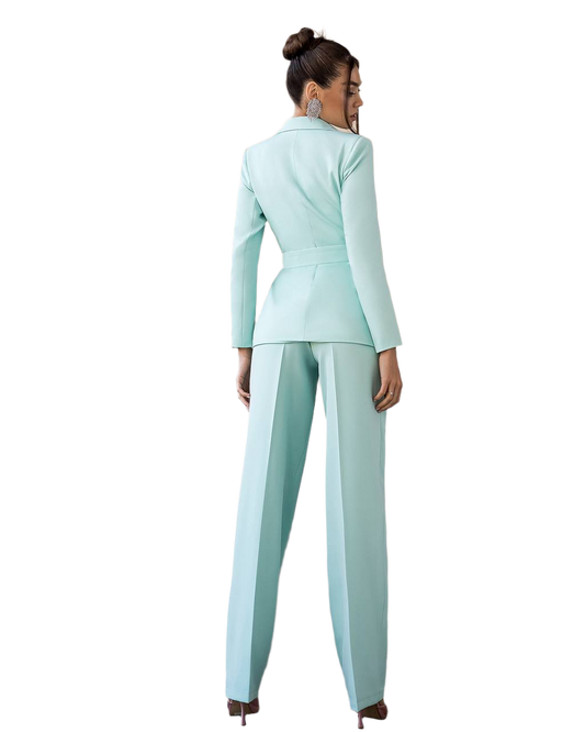 Woman wearing a light blue suit on a white background