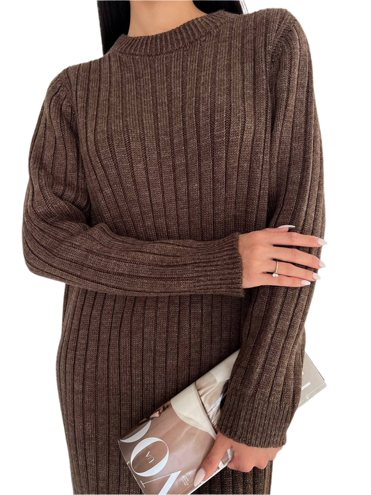 Brown ribbed sweater worn by a person holding a magazine on a white background