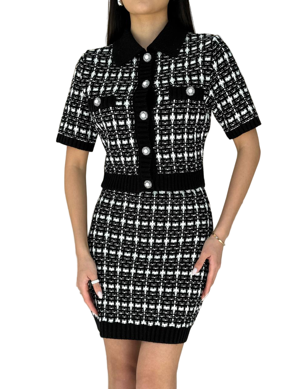 Black and white patterned dress with buttons on a white background