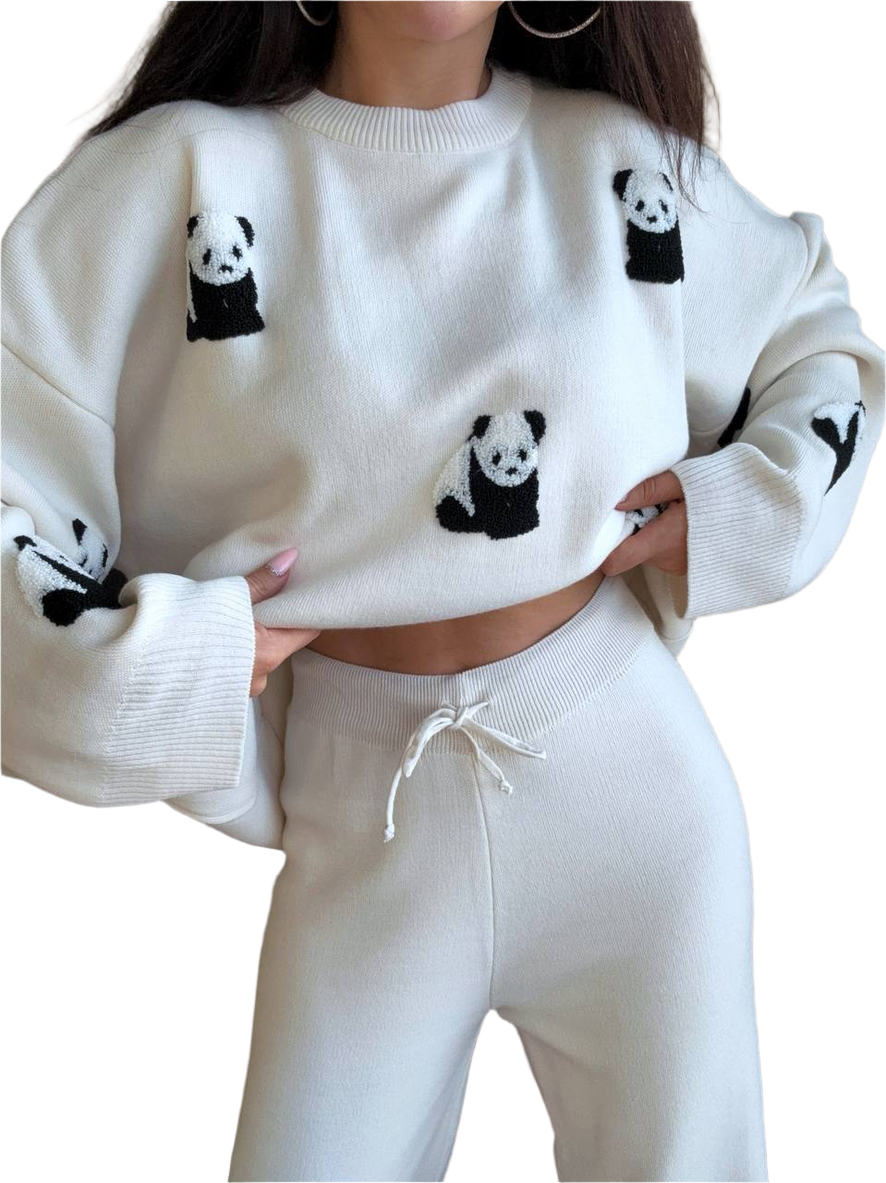 White sweater with panda designs worn by a person on a white background