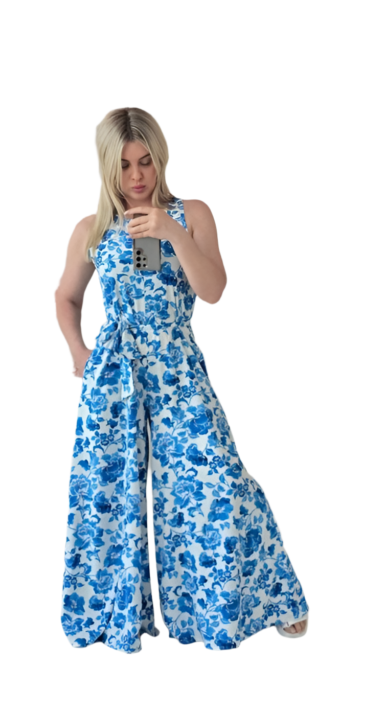 Woman wearing a blue floral dress on a white background