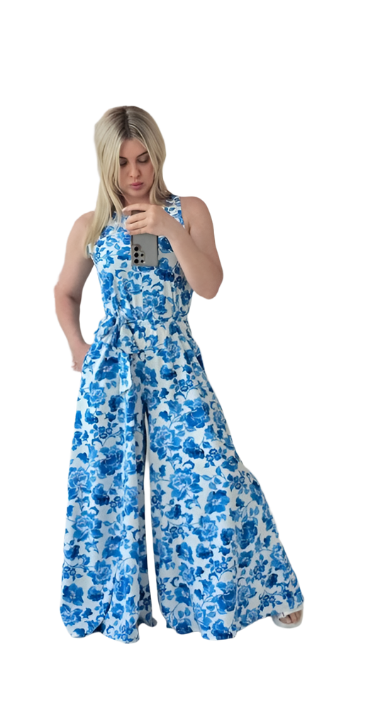 Woman wearing a blue floral dress on a white background