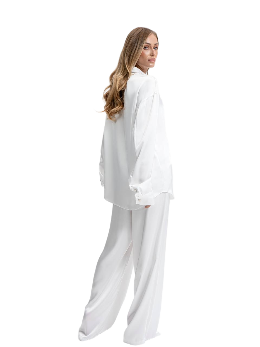 Woman wearing a white outfit on a white background