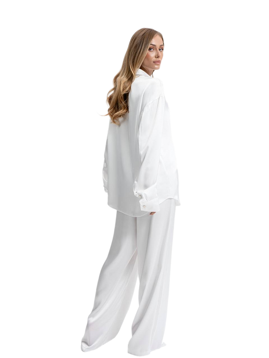 Woman wearing a white outfit on a white background