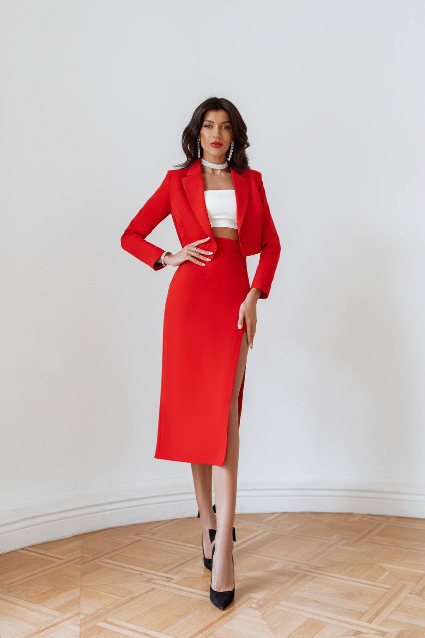 Woman wearing a red outfit with a white background