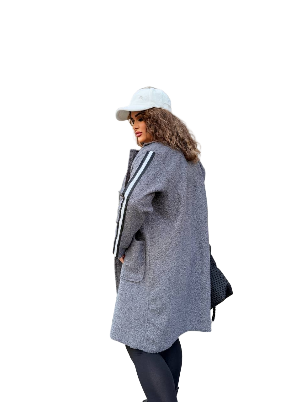 Person wearing a gray coat with a white cap on a white background