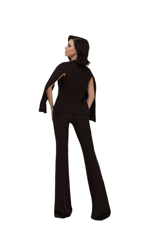 Person wearing a black outfit with cut-out design on a white background