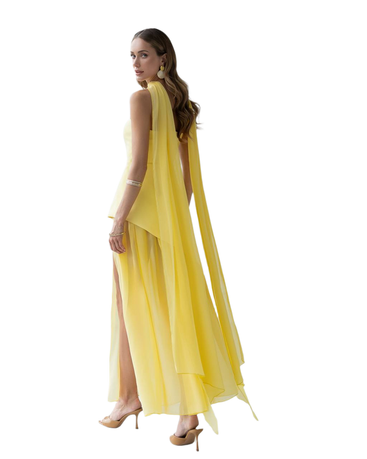 Woman wearing a yellow dress with a slit on a white background